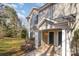 Inviting townhouse exterior with gray siding, green shutters, and a cozy covered entryway at 9562 Littleleaf Dr, Charlotte, NC 28215