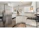 Modern kitchen with stainless steel appliances, granite countertops, and white subway tile backsplash at 9562 Littleleaf Dr, Charlotte, NC 28215