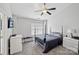 Serene bedroom with soft carpet, a ceiling fan, and a sun-filled window at 10094 Treeside Ln, Matthews, NC 28105