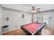 Recreation room complete with a pool table, decorative ceiling fan, and natural light at 10094 Treeside Ln, Matthews, NC 28105