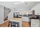 Well-lit kitchen boasting granite countertops, stainless steel appliances, and a breakfast bar at 10094 Treeside Ln, Matthews, NC 28105