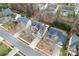 An aerial view of the neighborhood with mature trees lining a quiet residential street at 1017 Anduin Falls Dr, Charlotte, NC 28269