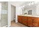 Bathroom featuring double vanity and a glass enclosed shower at 1017 Anduin Falls Dr, Charlotte, NC 28269