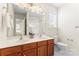 Bathroom with double sinks, a large mirror, and ample lighting at 1017 Anduin Falls Dr, Charlotte, NC 28269