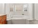 Bathroom featuring garden tub and natural light at 1017 Anduin Falls Dr, Charlotte, NC 28269