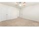 Bedroom with ceiling fan and double door closet at 1017 Anduin Falls Dr, Charlotte, NC 28269