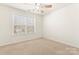 Bedroom featuring a ceiling fan and large window at 1017 Anduin Falls Dr, Charlotte, NC 28269