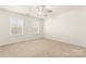 Bedroom filled with natural light from two windows at 1017 Anduin Falls Dr, Charlotte, NC 28269