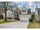 Charming two-story home with a two-car garage, manicured lawn, and mature trees at 1017 Anduin Falls Dr, Charlotte, NC 28269