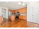 Large kitchen with stainless steel appliances, island, and hardwood floors at 1017 Anduin Falls Dr, Charlotte, NC 28269