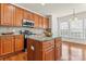 Gourmet kitchen featuring an island, stainless steel appliances, and granite countertops at 1017 Anduin Falls Dr, Charlotte, NC 28269