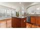 Spacious kitchen island with stainless steel dishwasher and granite countertops at 1017 Anduin Falls Dr, Charlotte, NC 28269