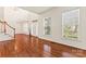 Bright living room featuring gleaming hardwood floors, ample natural light, and elegant trim at 1017 Anduin Falls Dr, Charlotte, NC 28269