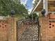 Decorative wrought iron gate with brick pillars at 1030 Bolling Rd, Charlotte, NC 28207