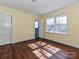 Bedroom with hardwood floors, two windows, neutral walls and an ensuite bathroom at 1030 Bolling Rd, Charlotte, NC 28207