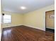 A spacious bedroom is designed for relaxation, offering ample natural light and hardwood floor at 1030 Bolling Rd, Charlotte, NC 28207