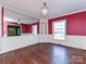 A bright dining room with hardwood floors, and an ornate chandelier at 1030 Bolling Rd, Charlotte, NC 28207