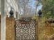 Ornate wrought iron gate entrance set between brick pillars, enhancing the property's curb appeal at 1030 Bolling Rd, Charlotte, NC 28207