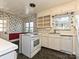 Classic kitchen with white cabinets and black floor at 1030 Bolling Rd, Charlotte, NC 28207