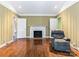 Inviting living room features a cozy fireplace, hardwood floors, and neutral wall colors at 1030 Bolling Rd, Charlotte, NC 28207