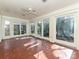 Bright sunroom with tile floor and access to backyard at 1030 Bolling Rd, Charlotte, NC 28207