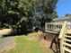 Serene backyard setting with a fire pit, great for entertaining and enjoying nature at 104 Trestle Cir, New London, NC 28127