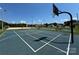 Well-maintained blue basketball court with clearly marked lines and hoops, perfect for sports enthusiasts at 104 Trestle Cir, New London, NC 28127