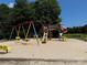 Colorful playground with slides, swings, and climbing structures, offering a fun space for children at 104 Trestle Cir, New London, NC 28127