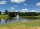 Scenic view of a pond with a central fountain surrounded by lush greenery at 104 Trestle Cir, New London, NC 28127