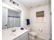 Well-maintained bathroom with a single vanity and shower-tub combination at 10836 Clark St, Davidson, NC 28036