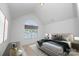 Light-filled bedroom with a large arched window and neutral decor at 10836 Clark St, Davidson, NC 28036