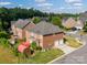 Back of home featuring deck, shed, two-car garage, and green lawn at 10836 Clark St, Davidson, NC 28036