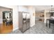 Stainless steel refrigerator in the kitchen, offering access to dining and living areas at 10836 Clark St, Davidson, NC 28036