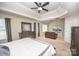 Large main bedroom with tray ceiling, sitting area, and ample natural light from multiple windows at 10836 Clark St, Davidson, NC 28036