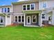 Exterior backyard with a patio, grassy area, and views of the home at 109 Alluvium Ln, Waxhaw, NC 28173