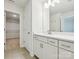 Bathroom featuring a large vanity with storage, modern fixtures, and a view into the walk-in closet at 109 Alluvium Ln, Waxhaw, NC 28173