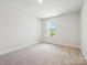 Bright bedroom with a cozy carpet, large window letting in natural light at 109 Alluvium Ln, Waxhaw, NC 28173