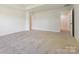 Spacious bedroom featuring neutral carpet, recessed lighting, and access to two closets for ample storage at 109 Alluvium Ln, Waxhaw, NC 28173