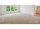 Large bedroom with neutral carpet, many windows for natural light, and an ensuite bathroom at 109 Alluvium Ln, Waxhaw, NC 28173