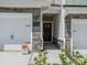Charming entrance with stone accents around garage and front door. A beautiful place to call home at 109 Alluvium Ln, Waxhaw, NC 28173