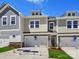 Charming townhomes showcasing diverse exterior finishes and manicured landscaping at 109 Alluvium Ln, Waxhaw, NC 28173