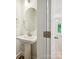 Stylish powder room with a pedestal sink, modern fixtures, and a view into the hallway at 109 Alluvium Ln, Waxhaw, NC 28173