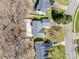 Aerial view of the house showing the driveway and surrounding neighborhood at 11000 White Stag Dr, Charlotte, NC 28269