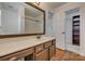 Bathroom with vanity, mirror, and view of shower and closet at 11000 White Stag Dr, Charlotte, NC 28269