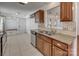 Cozy kitchen area featuring stainless steel appliances, granite countertops, and ample cabinet storage at 11000 White Stag Dr, Charlotte, NC 28269
