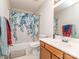 Standard bathroom with a shower-tub combo and a wood vanity at 11014 Fox Mill Ln, Charlotte, NC 28277