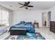 Comfortable bedroom featuring a ceiling fan, and neutral colored walls at 11014 Fox Mill Ln, Charlotte, NC 28277