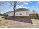 Backyard with a large tree, providing shade to the property, and a fence line at 1107 Franklin Thomas Pl, Charlotte, NC 28214