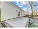 Concrete patio with white vinyl siding on the home's rear elevation at 1107 Franklin Thomas Pl, Charlotte, NC 28214