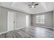 Neutral bedroom with trey ceiling, ceiling fan, and updated flooring, providing a soothing retreat at 1107 Franklin Thomas Pl, Charlotte, NC 28214